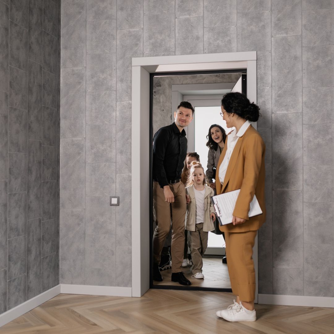 Relator showing a family a new home.